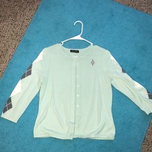 Teal cardigan/sweater.